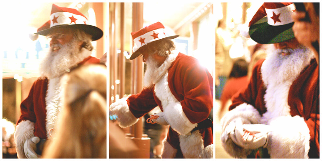 Old-timey Santa with a cowboy hat and ruddy cheeks.