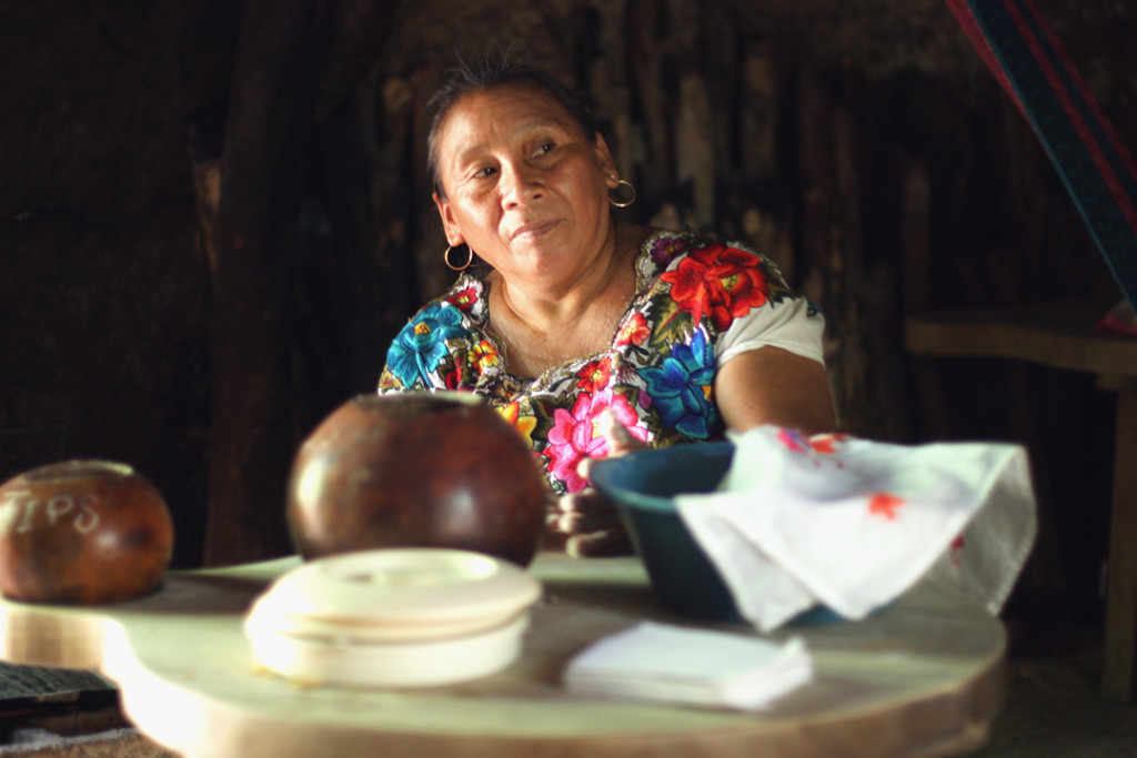 Visiting the Mayan Jungle: This beautiful woman stopped to pose for me as she was in the midst of making tortillas