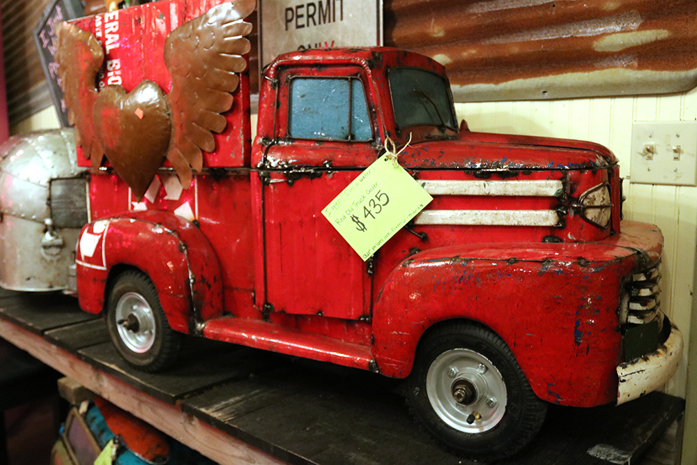 Antique metal truck for sale in Gruene Texas.