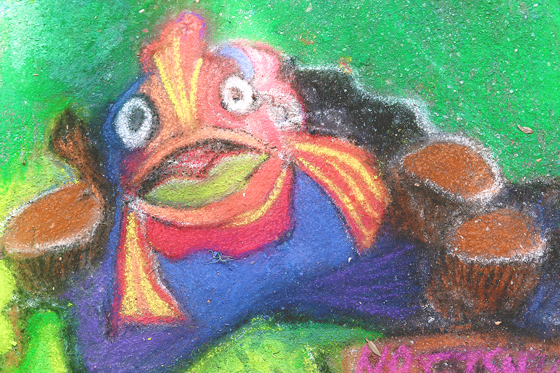 Multi-colored fish drawn on a sidewalk in chalk.