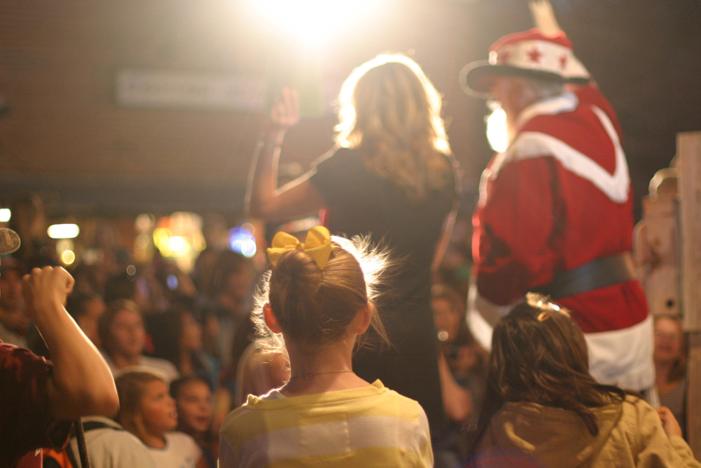 Cowboy Kris Kringle gives a speech as the crowd watches in Gruene, TX.