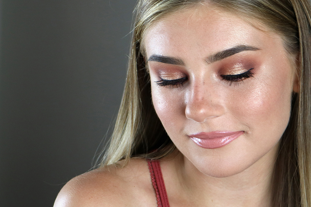 Taylor Hill 2017 Met Gala makeup tutorial: Image of girl looking down so rust colored eyeshadow is apparent on eyelids.