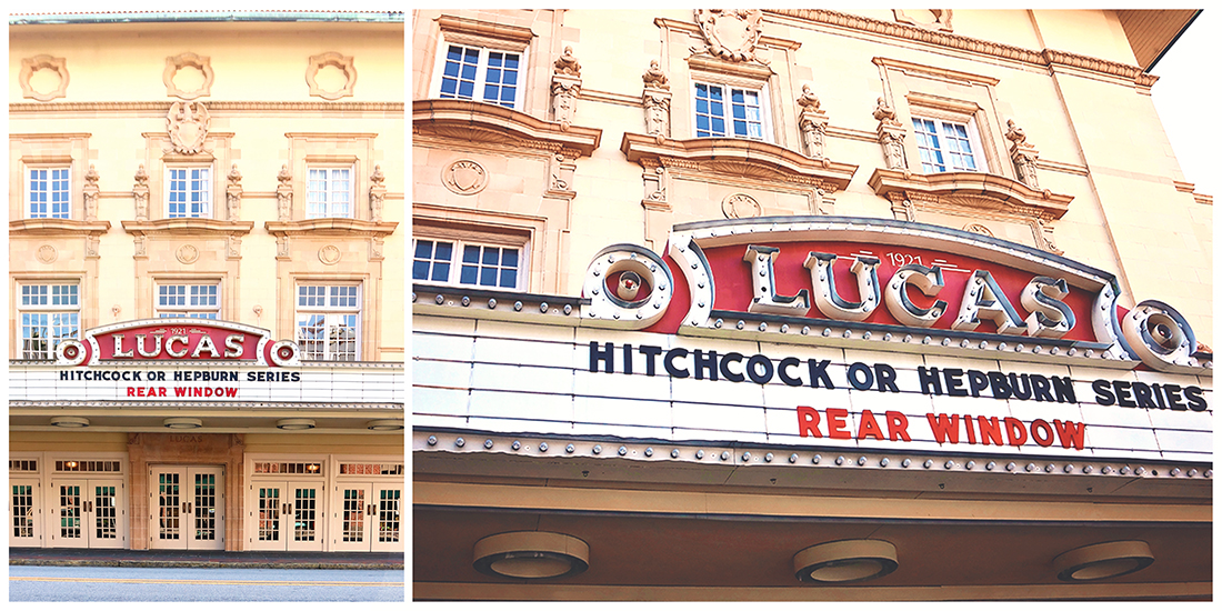 The famous marquee sign for the Lucas Theatre in Savannah Ga has white lettering and a bright red backdrop.