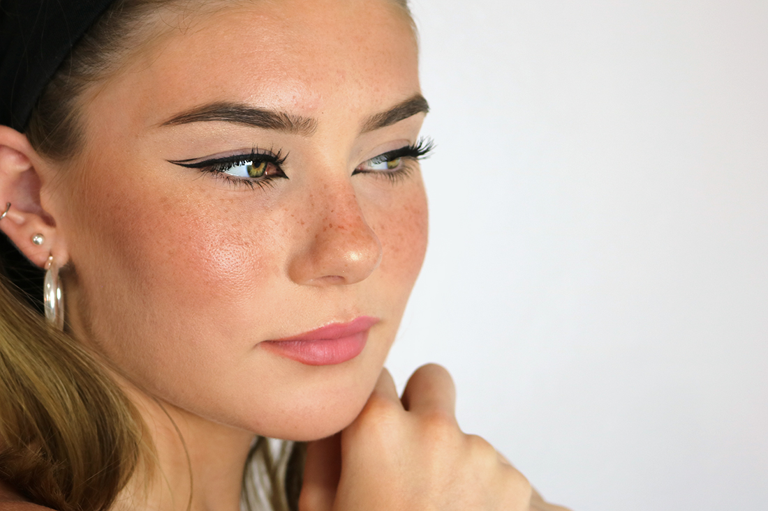 Side view of a Nicola Peltz graphic eyeliner tutorial 