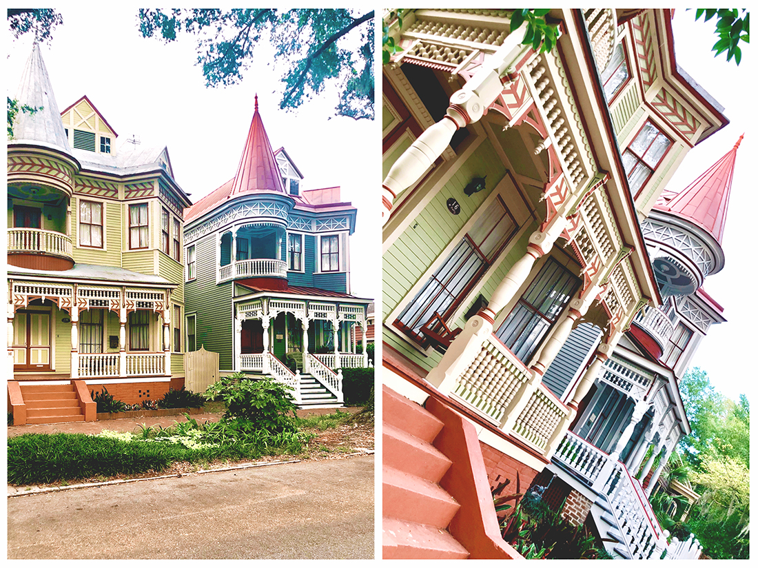 One green and one blue, but otherwise identical, Victorian homes that look like life-sized dollhouses.